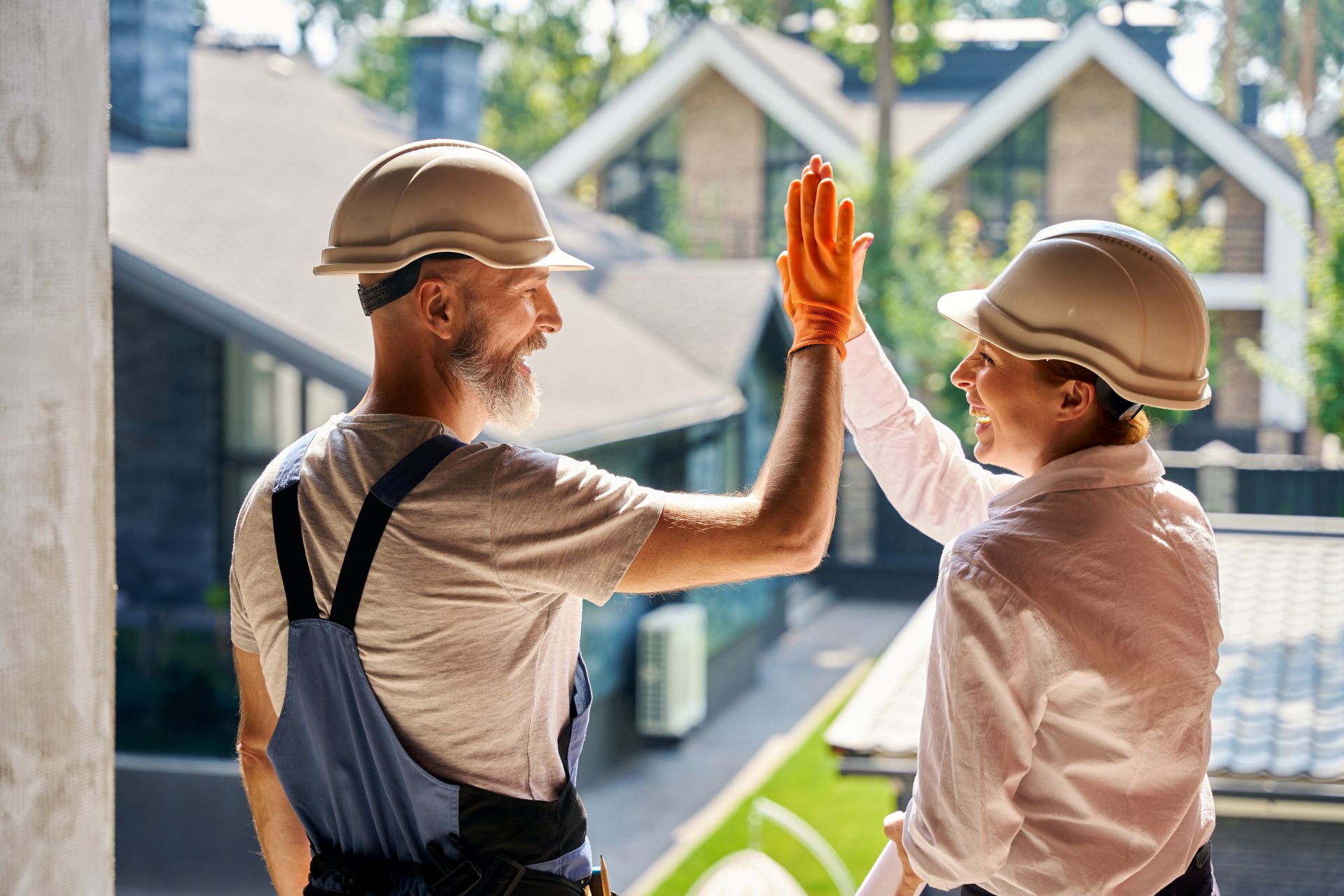 team-of-cheerful-construction-professionals-greeti-1920px team-of-cheerful-construction-professionals-greeti-1920px